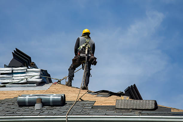 Professional Roof Replacement technician working in Sand Coulee, MT